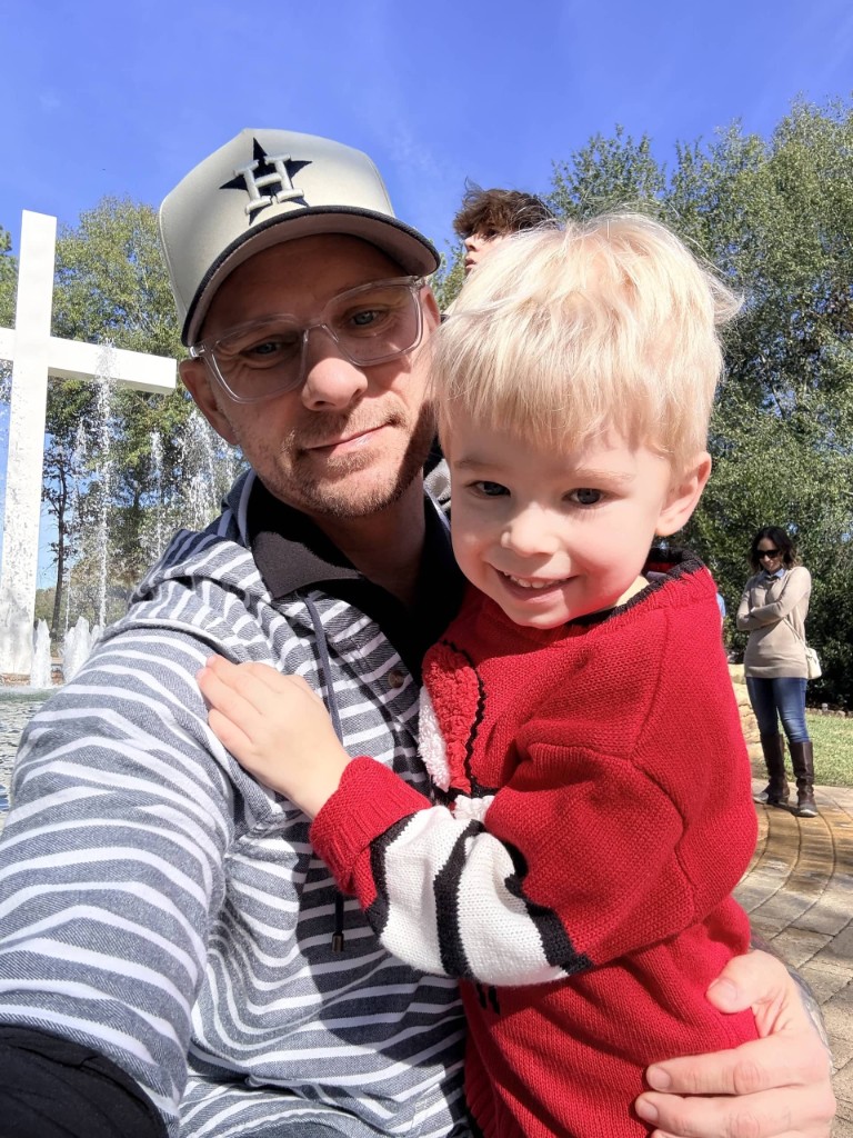 Christopher Fahey with his child outdoors