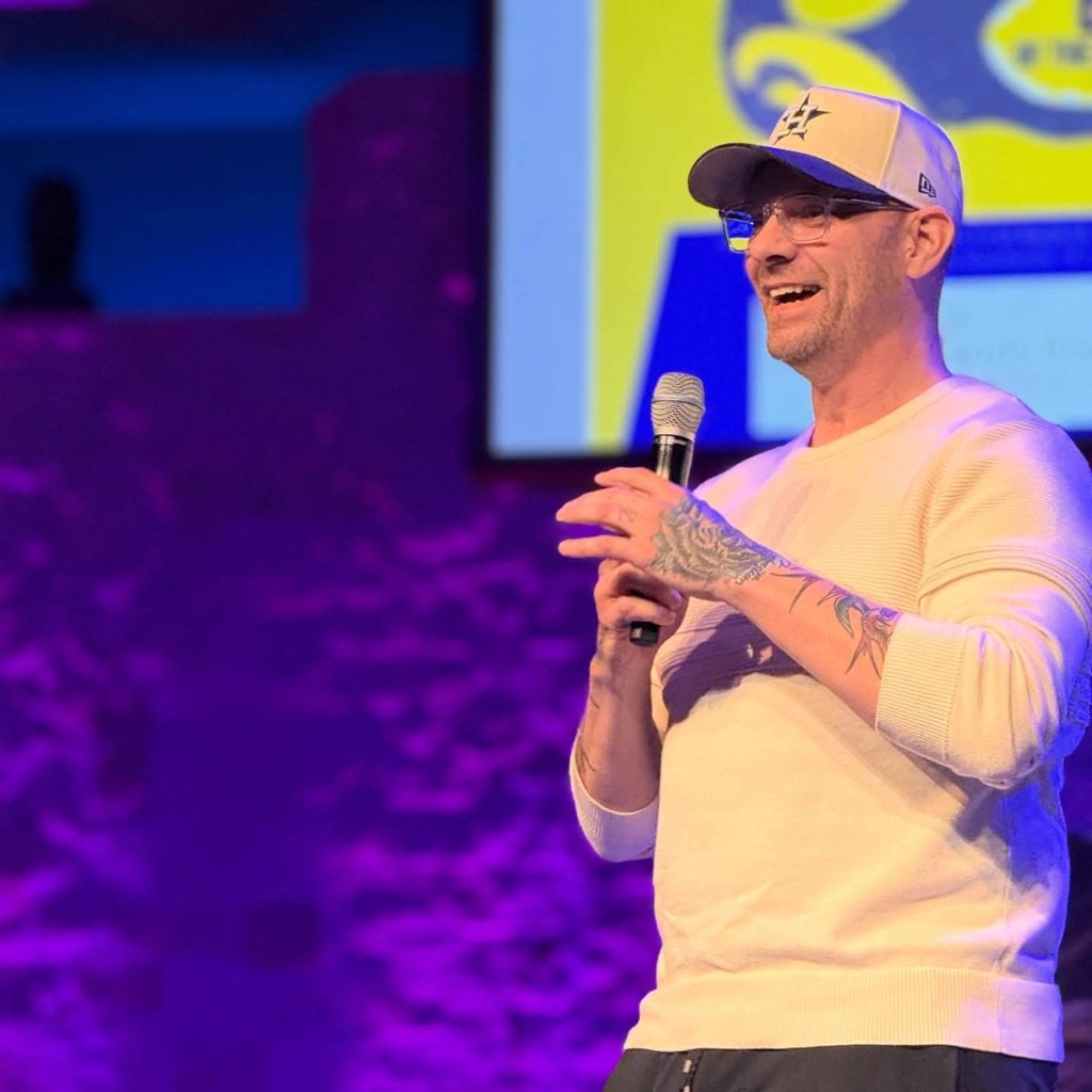 Chris Fahey speaking on stage